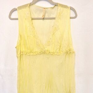 sheer butter yellow top. lacy and feminine. delicate. pale color
